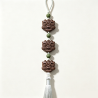 BEYUL Awakened Lion handmade aroma hanging charm with tassel — handmade pressed botanical beads, front view