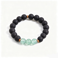 BEYUL Pearl Essence black incense bead bracelet with fluorite accents — handmade pressed botanical beads, front view