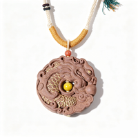 BEYUL Dragon Medallion aroma amulet pendant with cord and tassel — handmade pressed botanical beads, front view