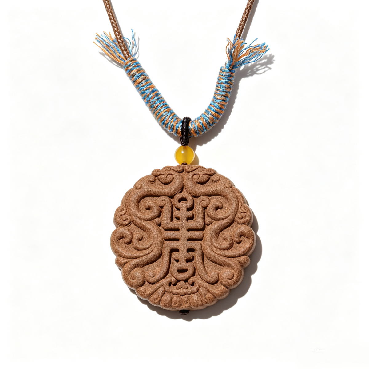BEYUL Auspicious Longevity aroma amulet pendant with cord and tassel — handmade pressed botanical beads, front view