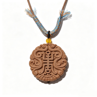 BEYUL Auspicious Longevity aroma amulet pendant with cord and tassel — handmade pressed botanical beads, front view